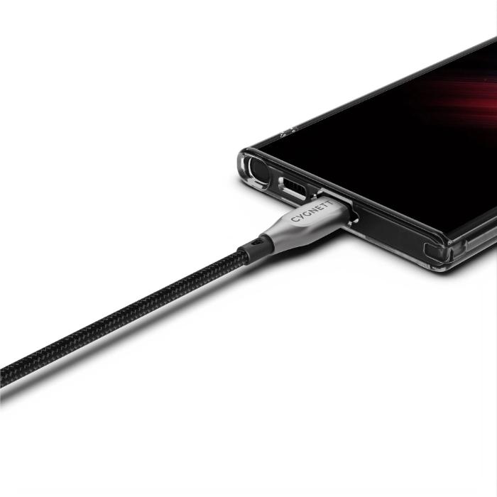 Phone case with Cygnett Armoured Kevlar 100w Type C to C Fast Charging Data Cable plugged into it on a white background