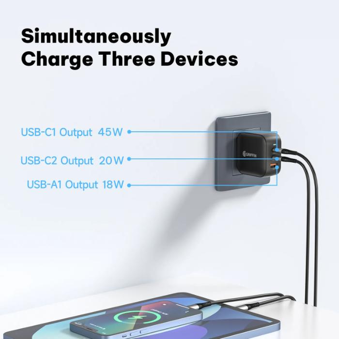 Wall-mounted Black GRIFFIN PowerBlock 70w GaN PD3.0 Fast Charging Wall Charger and a smartphone being charged.