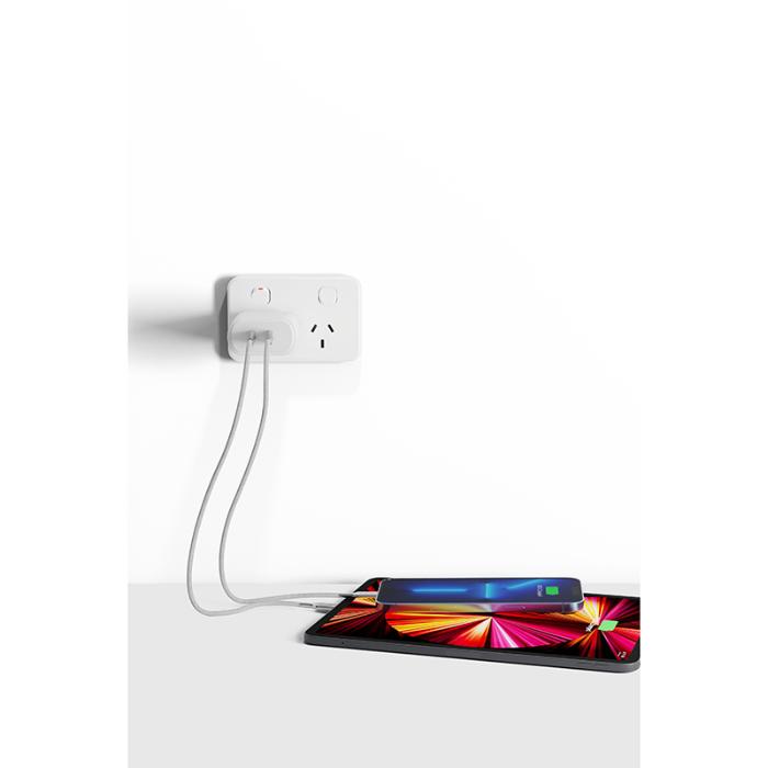 Smart home device with a colorful display connected to a White Cygnett PowerPlus 35w Dual USB-C Fast Charging Wall Charger on a white background