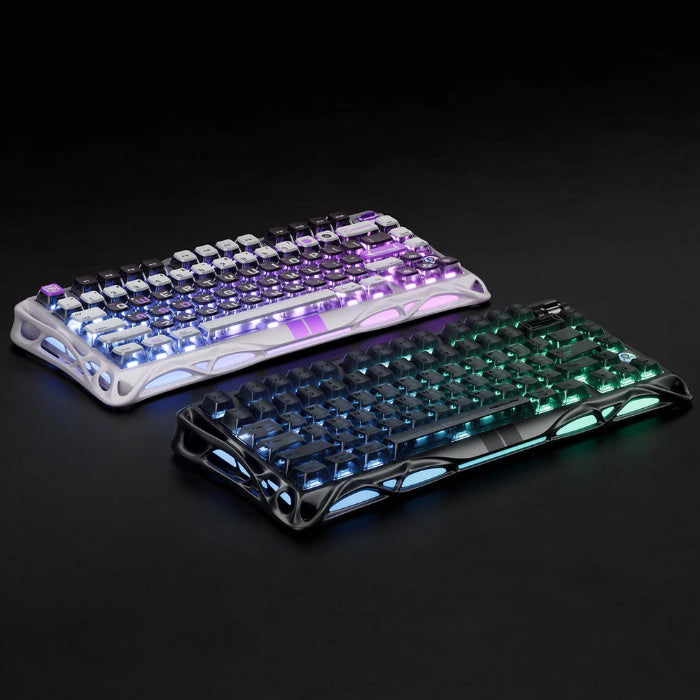 Stealth Black and Mecha Gray GravaStar Mercury V75 75% Hall Effect Magnetic Switch Gaming Keyboards with RGB lighting on a black background
