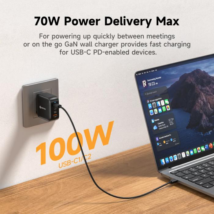 Black GRIFFIN PowerBlock 100w GaN PD3.0 Fast Charging Wall Charger with laptop on wooden surface, text about power delivery.