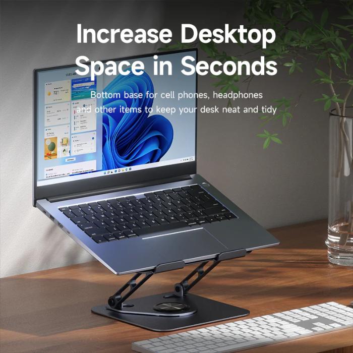 Laptop on a Space Grey HAGIBIS NBS04 Laptop Stand Carbon Steel Material with text 'Increase Desktop Space in Seconds' on a desk.